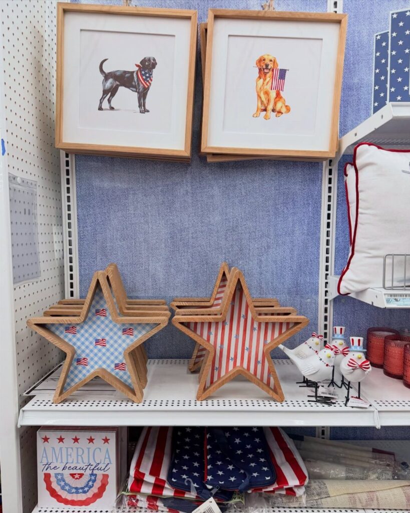 Patriotic red white and blue star decorations and dog art on store shelves