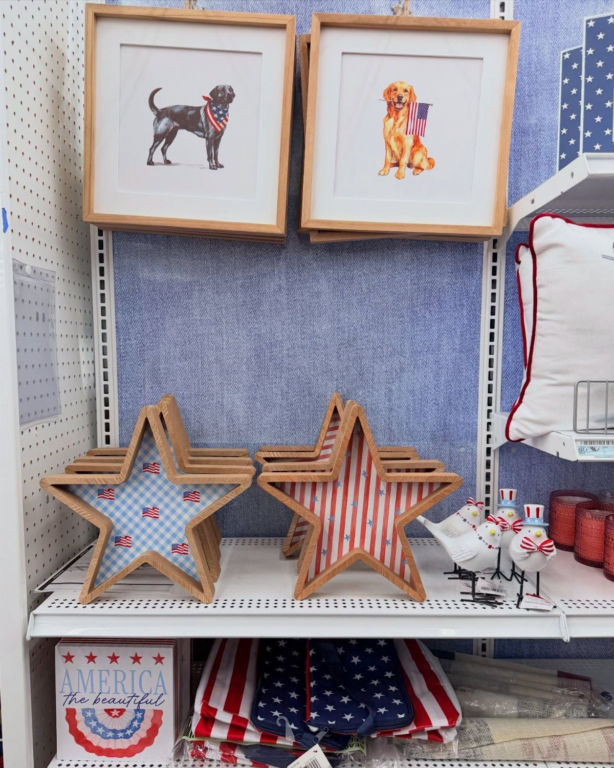 Patriotic red white and blue star decorations and dog art on store shelves