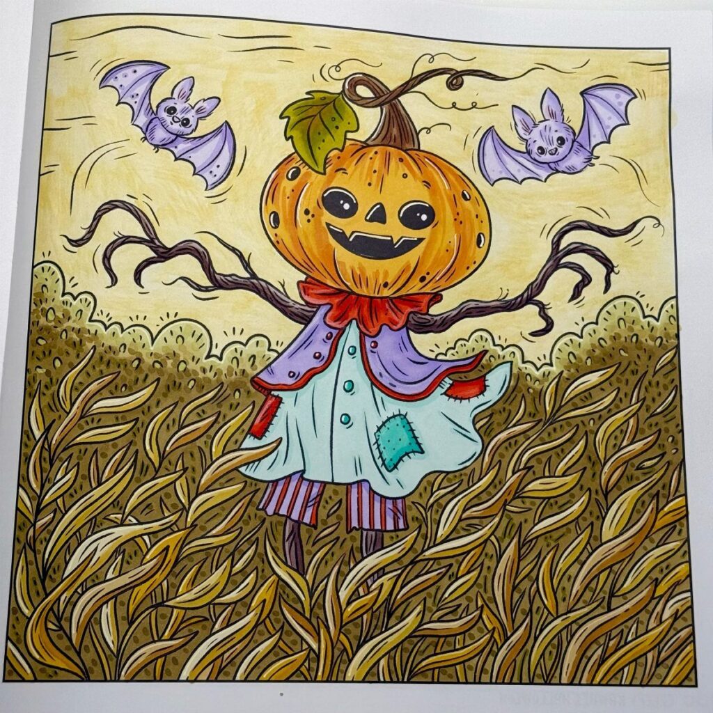 Pumpkin headed scarecrow in a cornfield with purple bats in the sky.