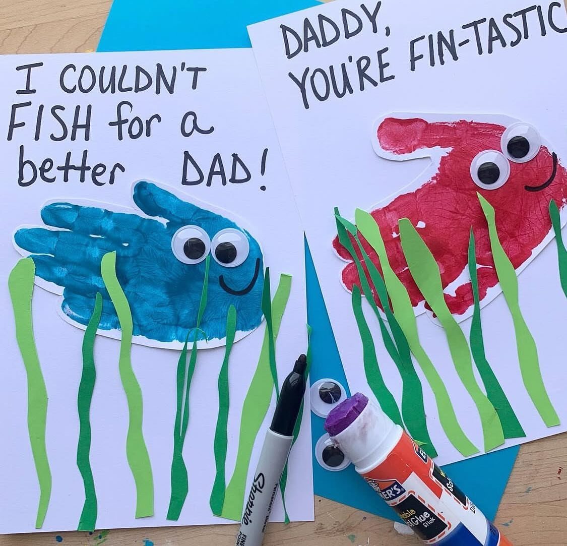 Handprint fish cards for Father's Day with colorful paint and paper seaweed.