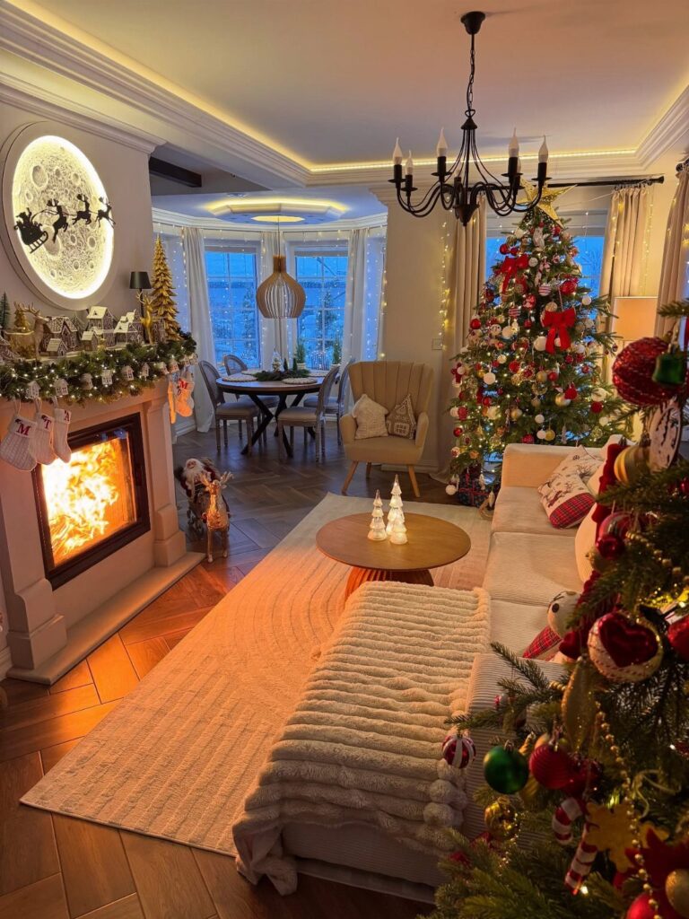 Cozy living room with a lit fireplace and decorated Christmas tree for holiday decor.