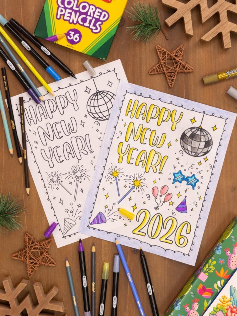 Two New Year coloring pages with 2026 text and disco balls on wooden table