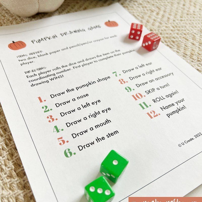 Pumpkin Drawing Game printable sheet with red and green dice on beige fabric